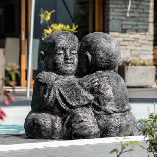 Grey weathered-finish embracing shaolin monk statue 40 cm