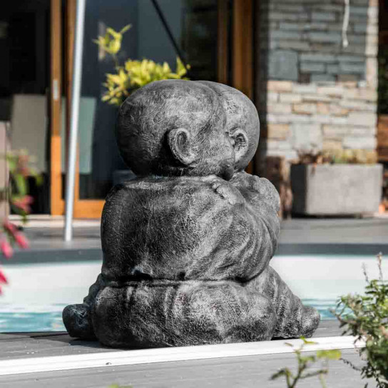 Grey weathered-finish embracing shaolin monk statue 40 cm