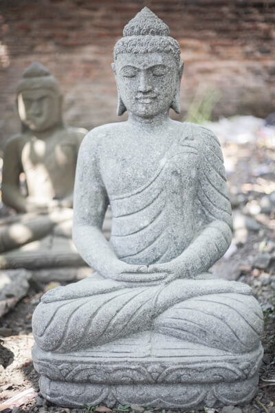 Buddha statue in a Japanese garden width=